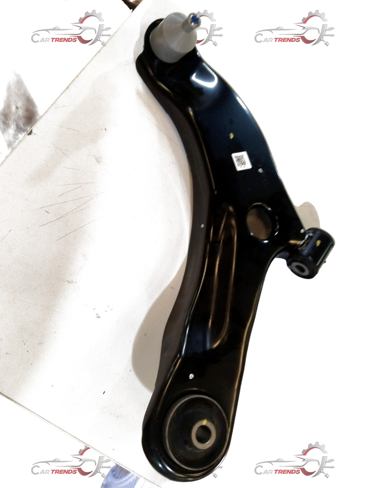CarTrends front suspension arm assembly for vehicle, showing the metal arm and mounting points of the spare parts.