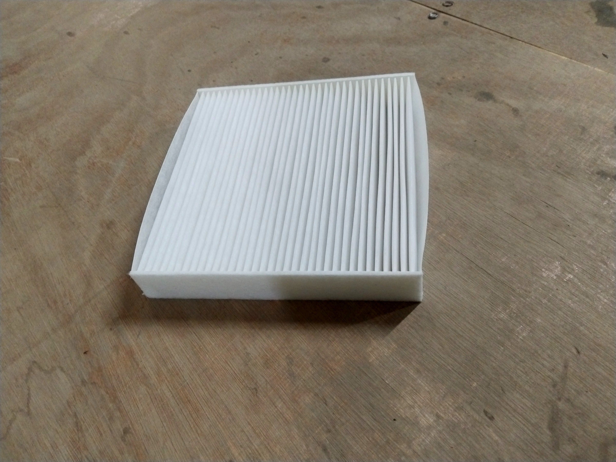 MARUTI SUZUKI AIR CONDITIONING FILTER | SUZUKI BALENO/ERTIGA/FRONX | #990J0M56RS0010 990J0M56RS0010 - Front view