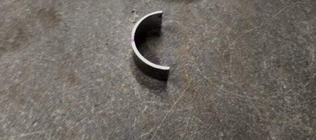 Maruti Suzuki bearing crankshaft for Swift, Baleno, Brezza, and Ertiga vehicles, shown as a lower crankshaft component.