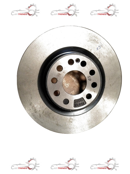 Mahindra XUV700 front brake disc, circular metal automotive part with vented design and mounting holes.