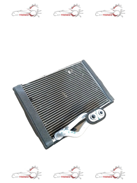 Maruti Suzuki evaporator sub-assembly part 95411M56R00 showing the compact HVAC component for vehicle air conditioning systems.