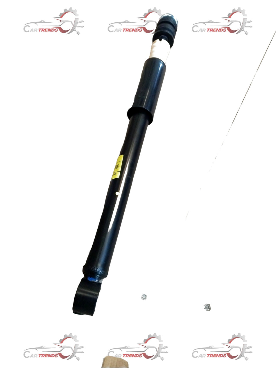 Rear shock absorber for Maruti Suzuki Ertiga, part number 41800M60M01, shown installed on the vehicle.