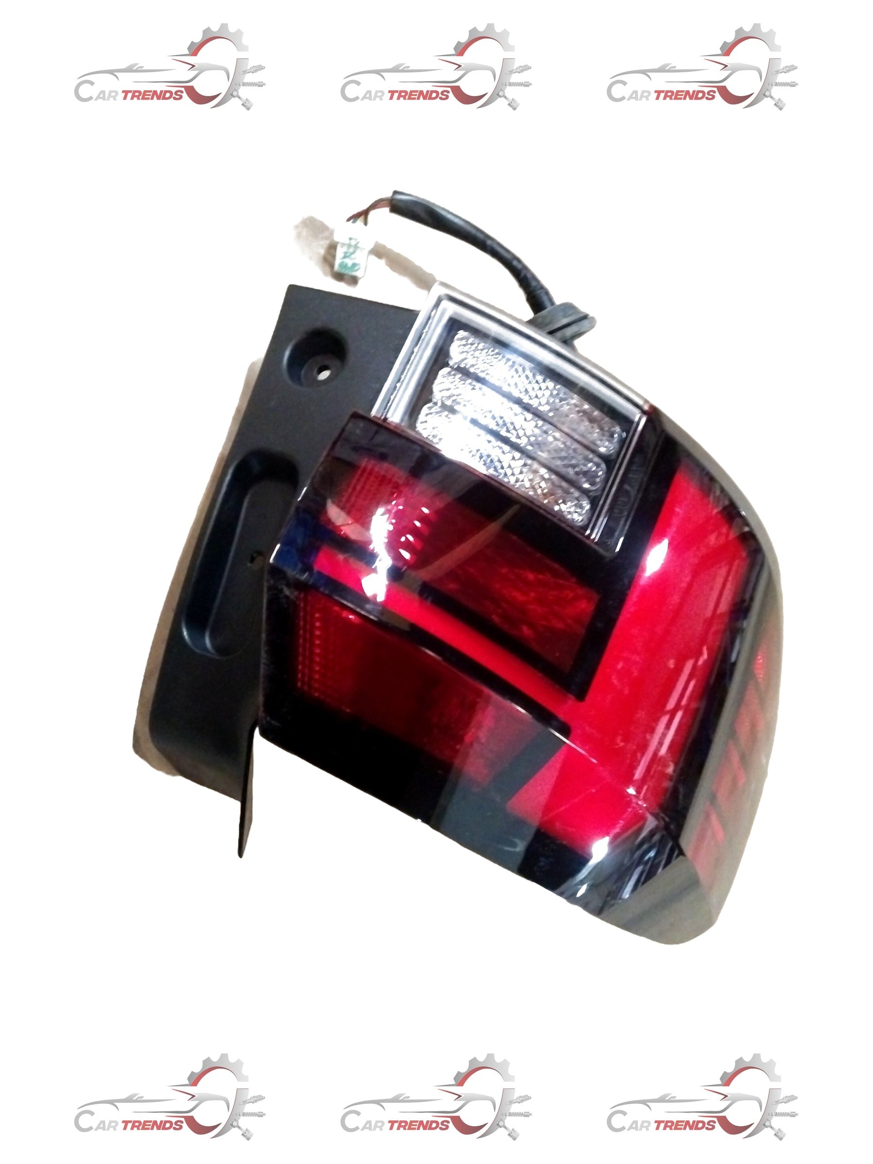 Hyundai Kia Sonet left tail lamp assembly with clear lens and black housing, showing the detailed bulb socket and wiring area.
