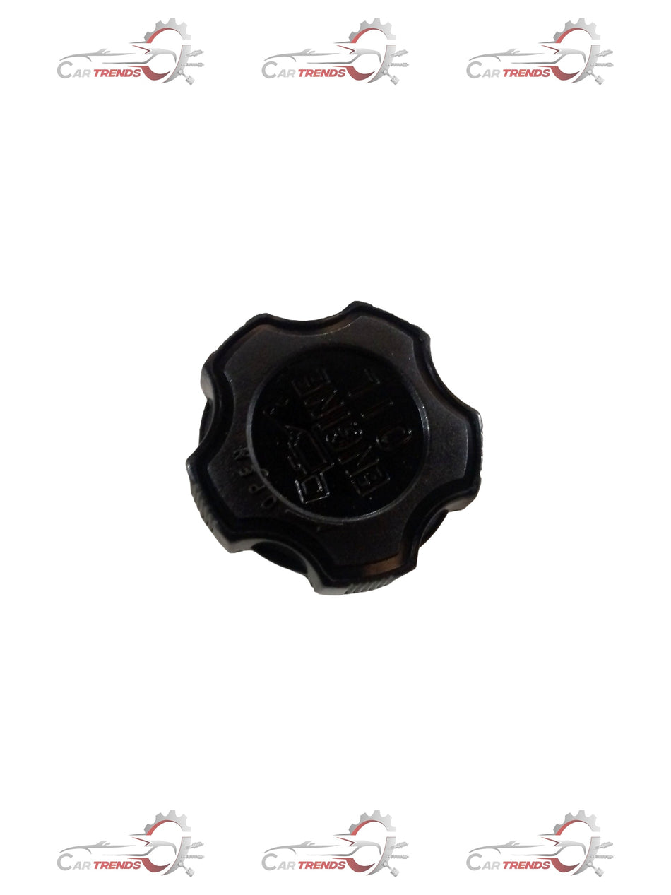 Maruti Suzuki oil cap filler showing a close-up of the black plastic oil fill cap on a vehicle engine.