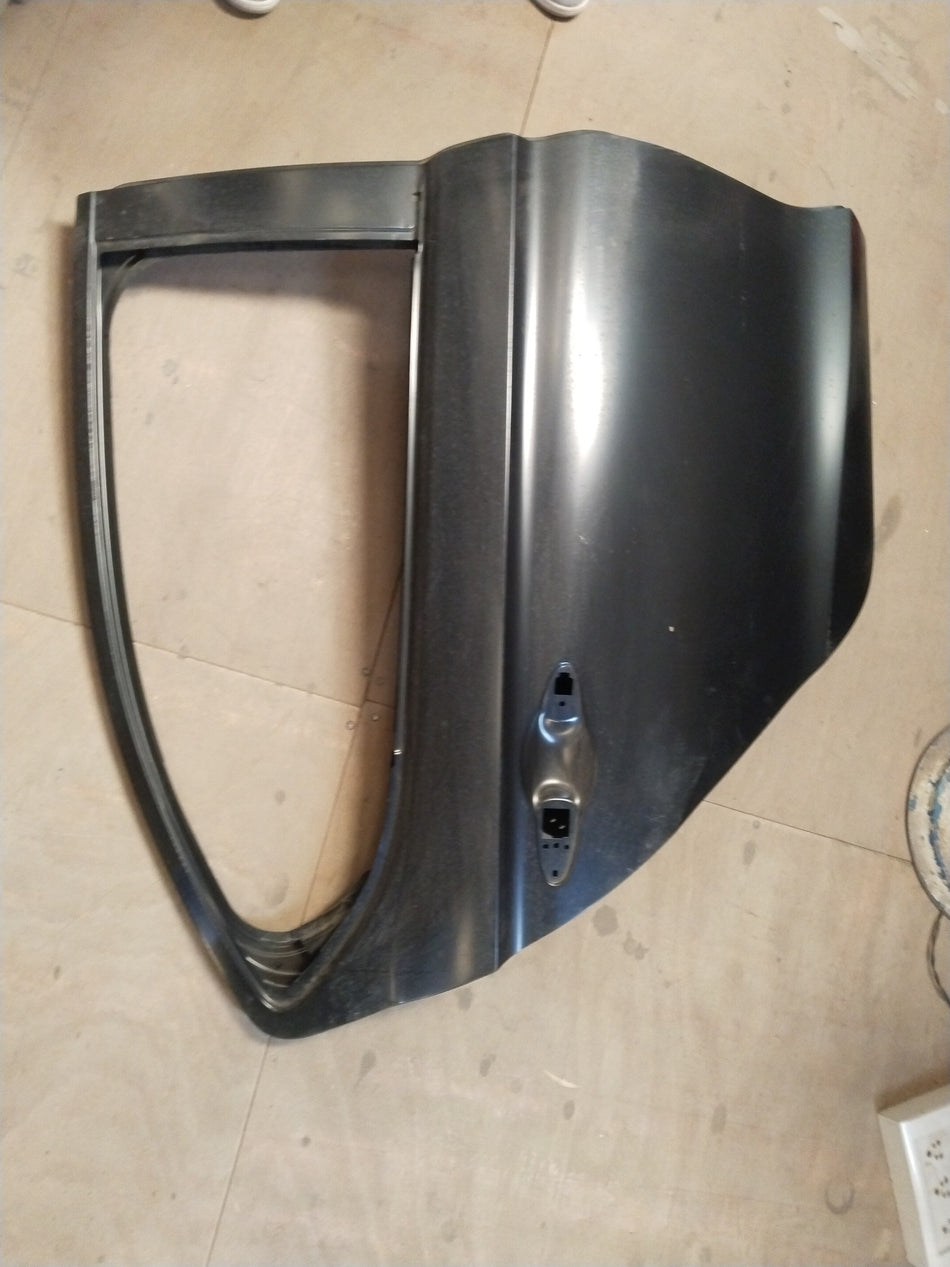 Honda City rear door panel, complete right-hand side, in black, showing the exterior side with handle and window cutout.