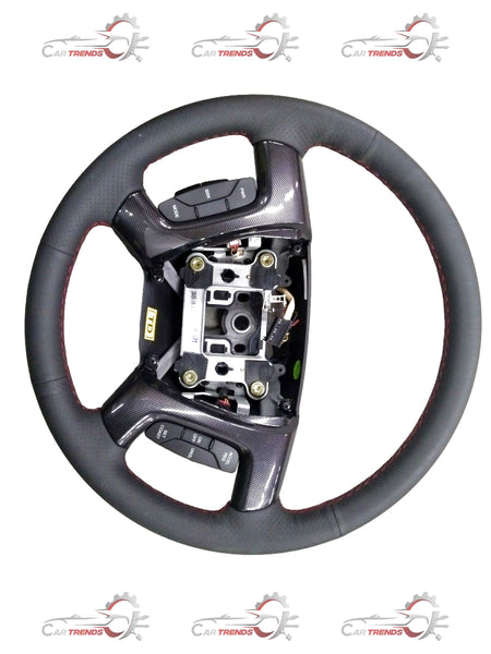 Steering wheel for Chevrolet Enjoy by General Motors, showing a close-up of the black automotive steering wheel with control buttons.