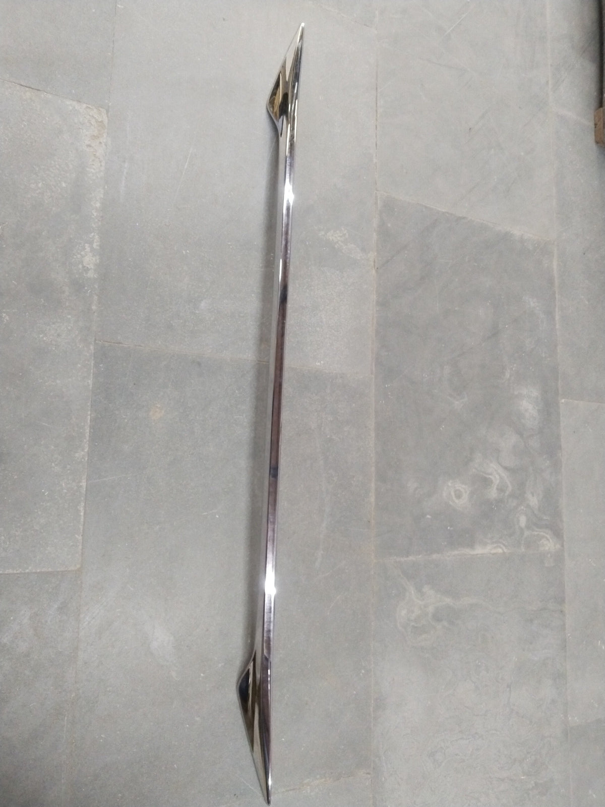 CarTrends back door garnish for Maruti Fronx, showing a sleek, chrome-finished trim piece mounted on the rear door of the vehicle.