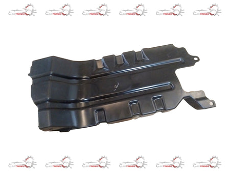 Maruti Suzuki engine front cover showing the protective plastic cover with mounting points and branding details visible.