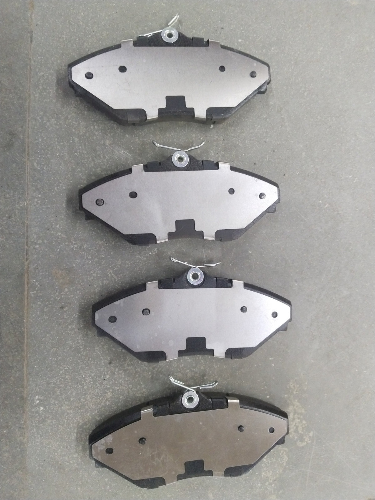 Front brake pad for Mahindra XYLO, Bolero VLX, TUV300, Genio, and Bolero NEO by CarTrends, showing the brake pad with mounting features.