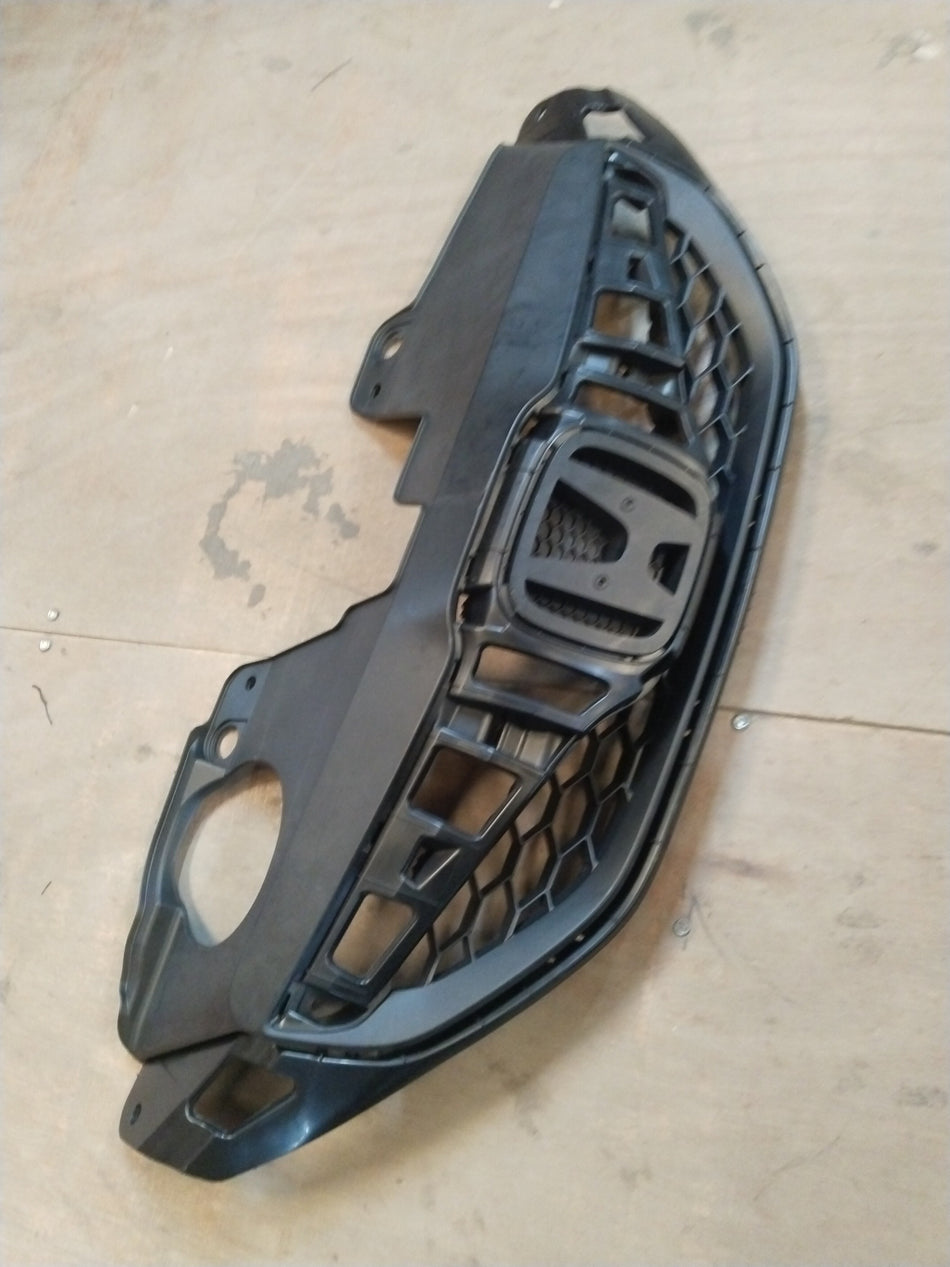 Honda Brio petrol front grille with the Brio logo, featuring a sleek design and chrome accents.