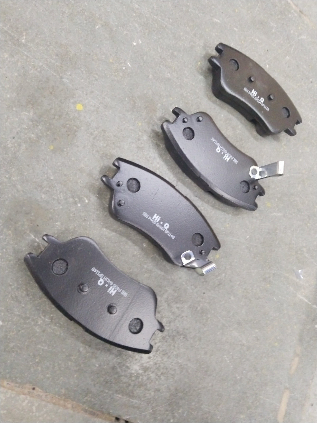 Front HI-Q brake pad for Hyundai Santro Xing, model SP1149, showing the black friction surface and metal backing.