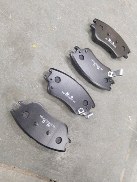 Front HI-Q brake pad for Hyundai Santro Xing, model SP1149, showing the black friction surface and metal backing.