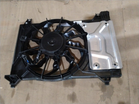 Maruti Suzuki cooling fan assembly for Suzuki Baleno, showing the fan motor and blades mounted on the cooling system.