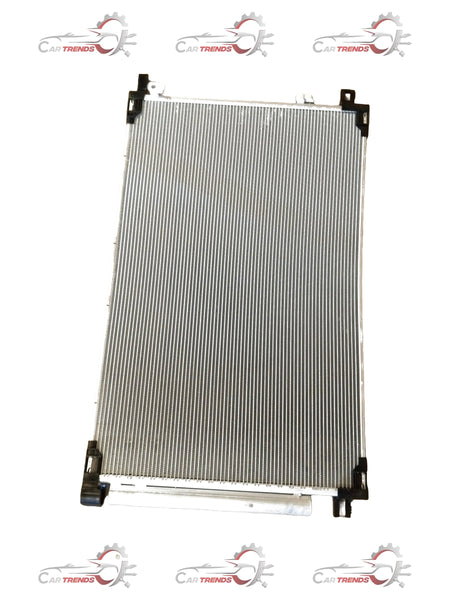 CarTrends condenser assembly supply for Inviato vehicles, showing a detailed view of the condenser unit with metal fins and connectors.