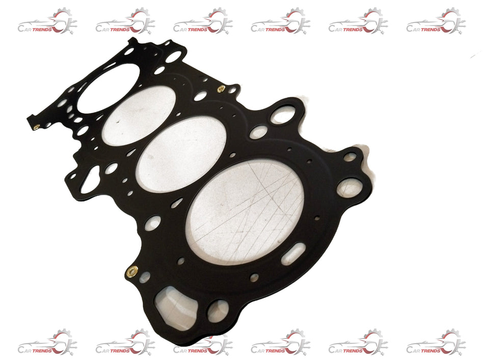 Maruti Suzuki head gasket for Ertiga vehicle, showing the metal and rubber sealing surface with bolt holes for engine sealing.