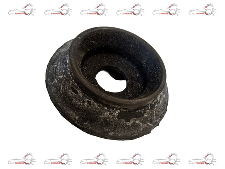 Nissan suspension strut from Mahindra Everito, showing the metal coil spring and mounting components.