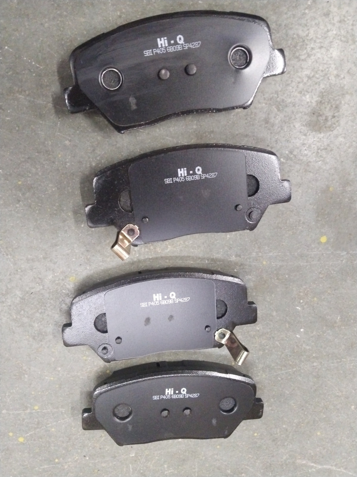 HI-Q front brake pad for Creta, Seltos, Sonet, Alcazar, Curan, high-quality auto part, shows the brake pad with branding and details.