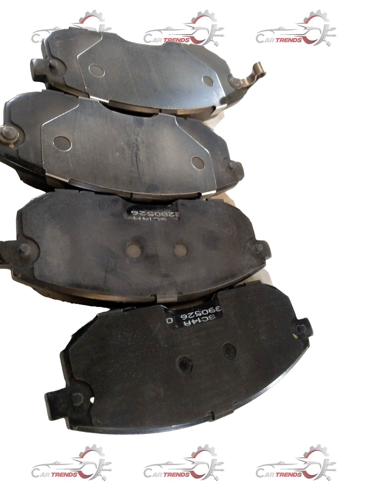 Front brake pad for Maruti Suzuki Brezza and Baleno, showing the metal backing and friction surface of the brake component.