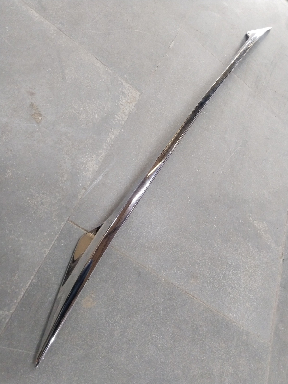 CarTrends back door garnish for Maruti Fronx, side view showing chrome finish and fitment on rear door.