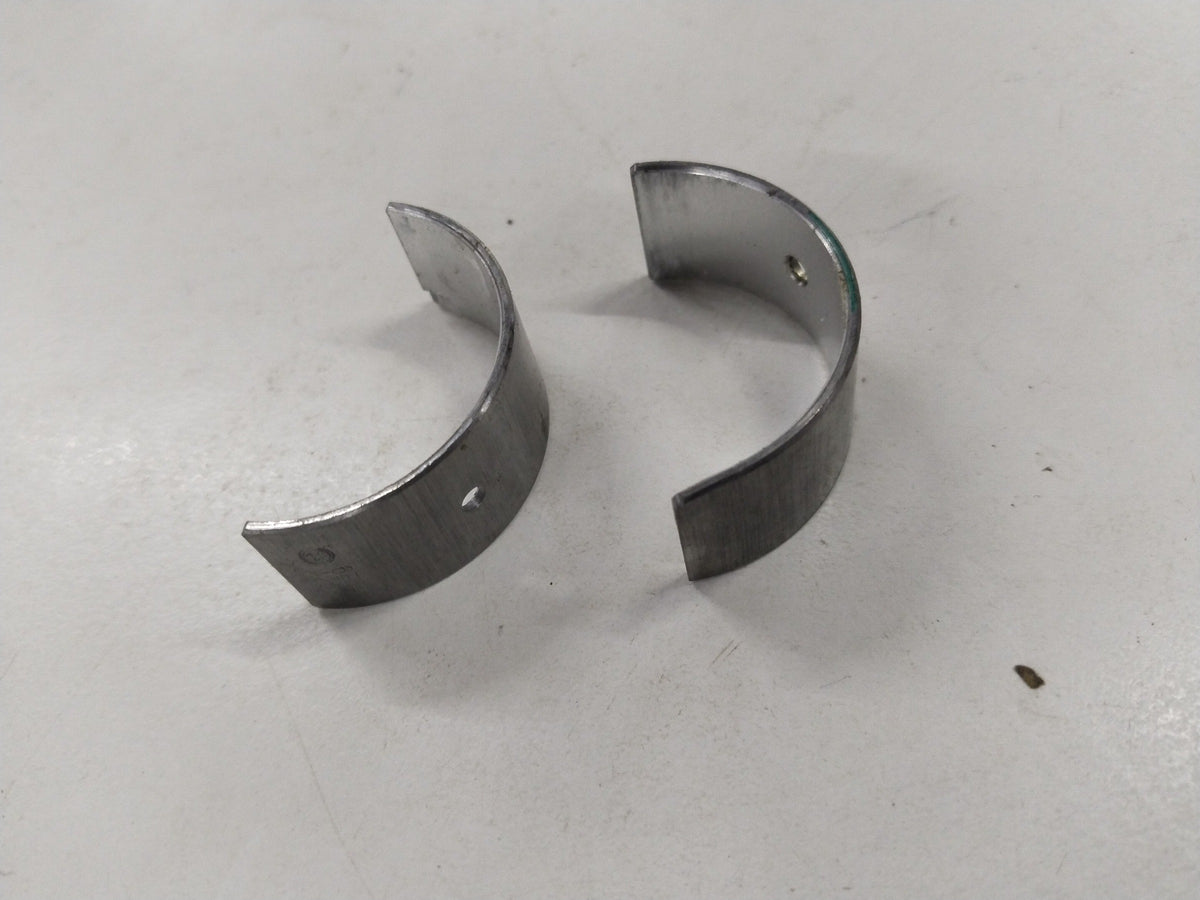General Motors Chevrolet Aveo bearing connecting rod, metallic component with precise machining and engine connection features.