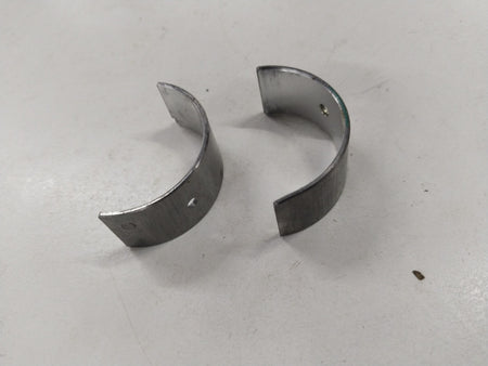 General Motors Chevrolet Aveo bearing connecting rod, metallic component with precise machining and engine connection features.