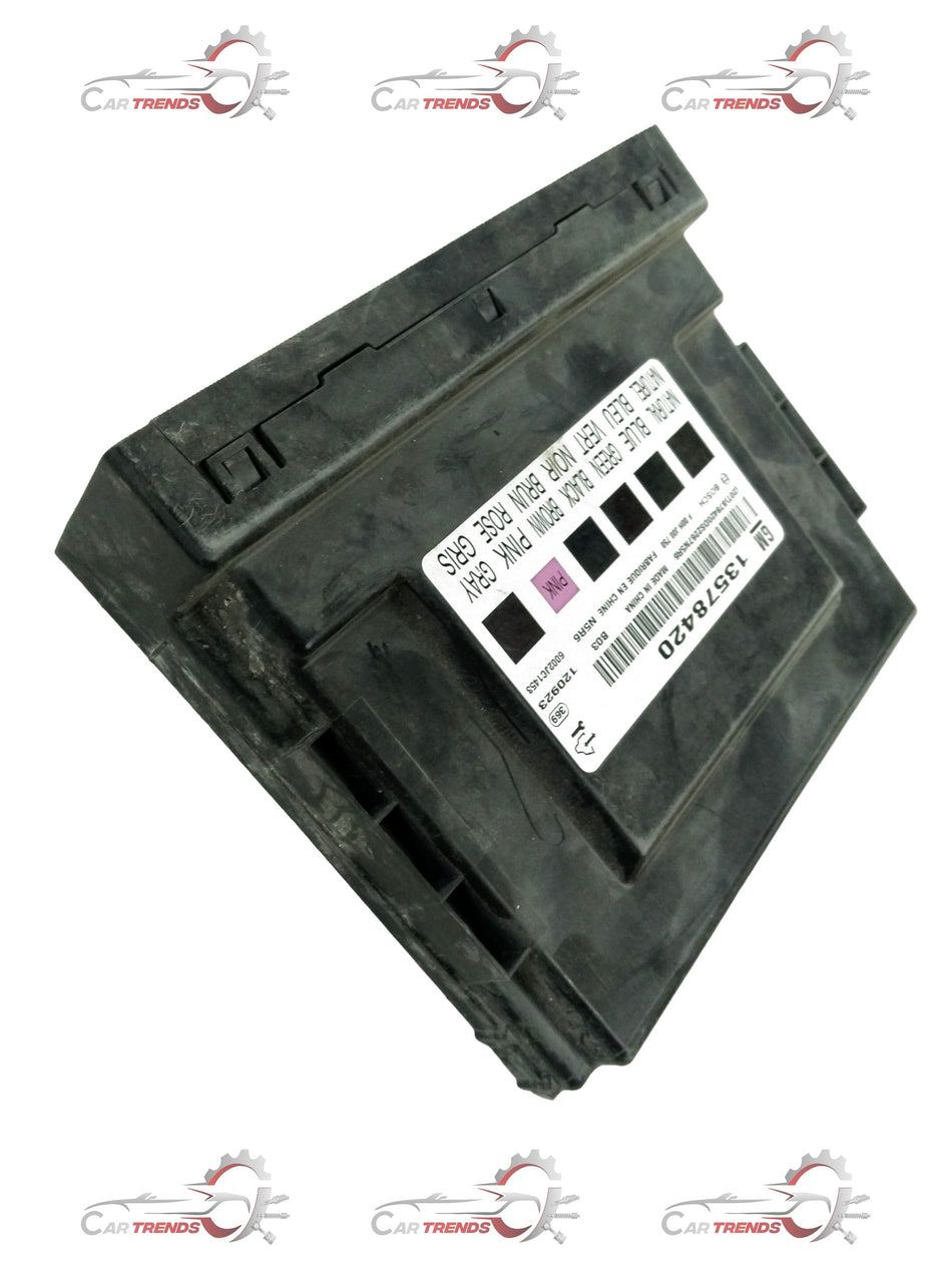 General Motors Chevrolet Cruze module assembly body control unit, showing a close-up of the electronic component with connectors.