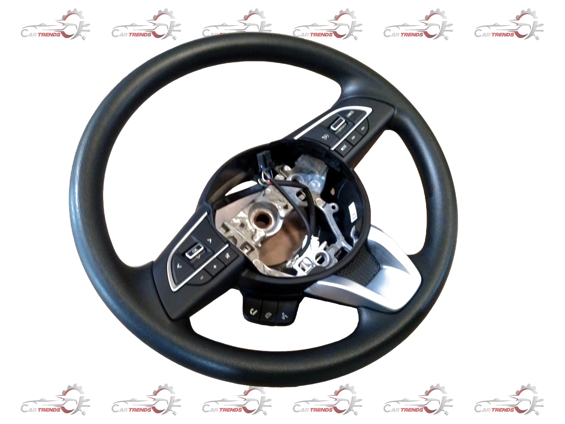 Maruti Suzuki steering wheel assembly showing the car's steering wheel with control buttons and branding.