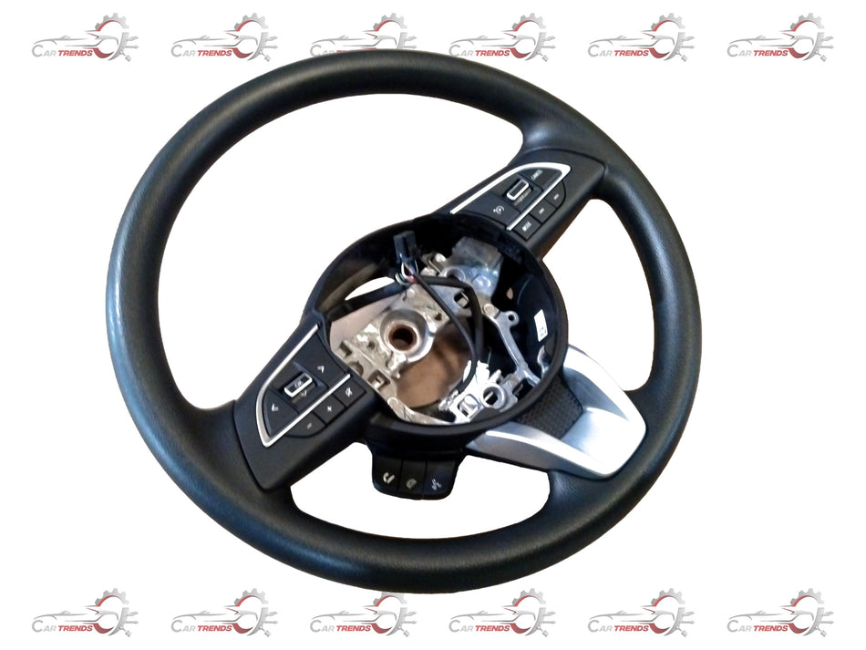 Maruti Suzuki Grand Vitara steering wheel assembly showing the black plastic and metal components of the car's steering wheel.