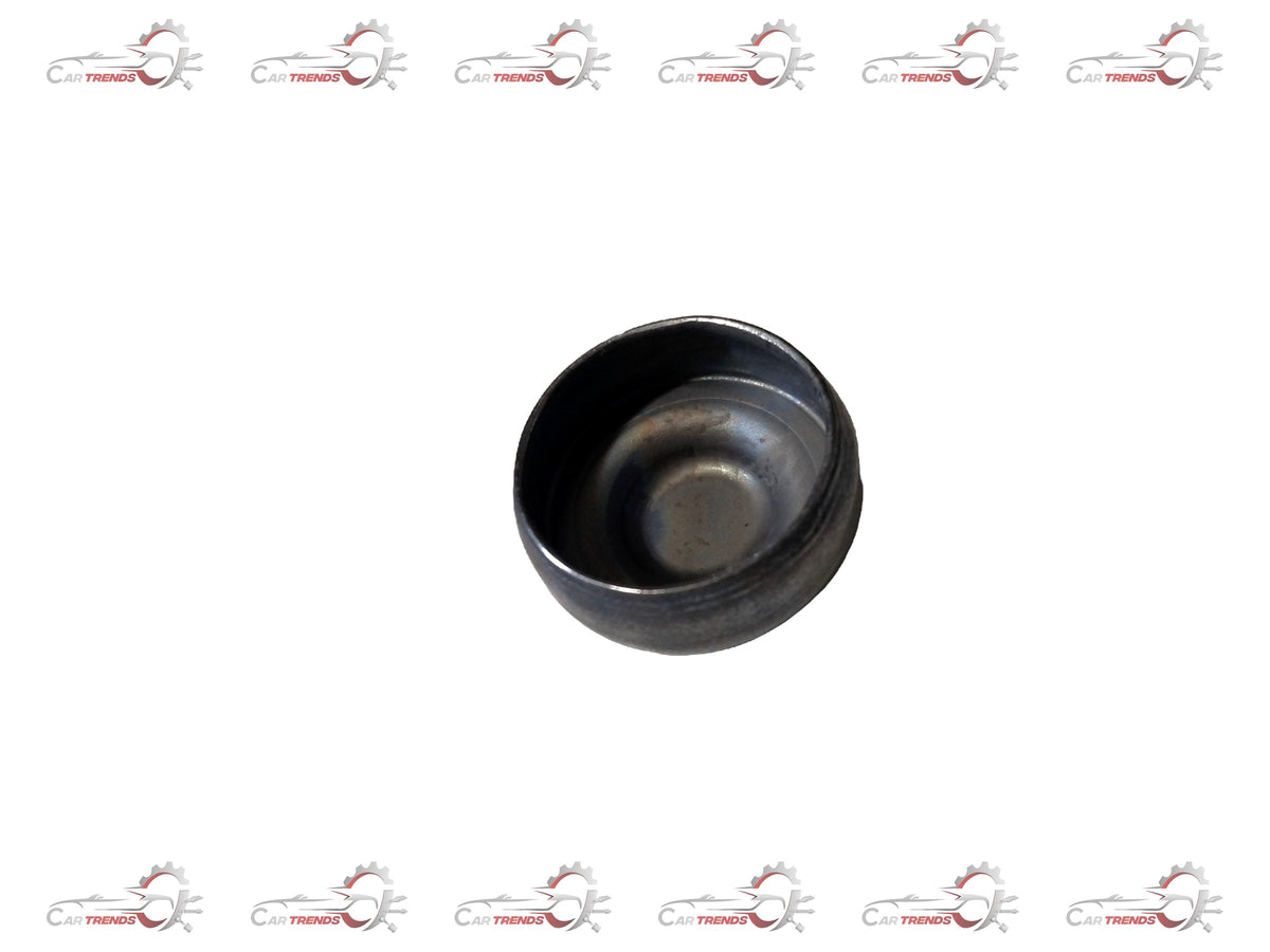 Ford engine plug, part #1225841, shown in a close-up image, designed for Ford engine maintenance and repairs