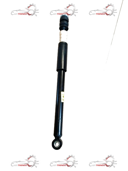 Maruti Suzuki Ertiga shock absorber rear view, showing the black metal component with mounting points and hydraulic parts.