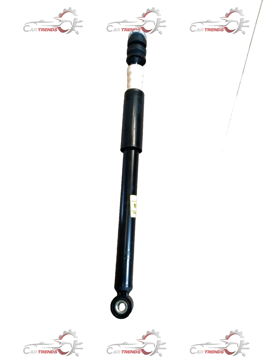 Maruti Suzuki Ertiga shock absorber rear view, showing the black metal component with mounting points and hydraulic parts.