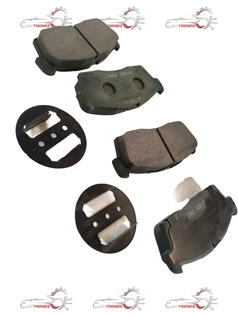 Front brake pad for Maruti Suzuki Alto K10, showing the black friction material and metal backing plate.
