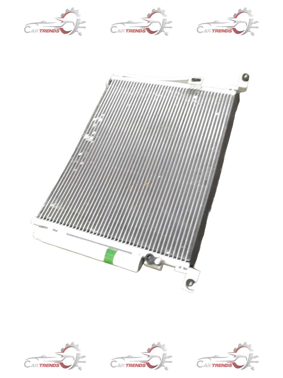 General Motors condenser assembly for Chevrolet Enjoy air conditioning system, showing the metal fins and connection points.