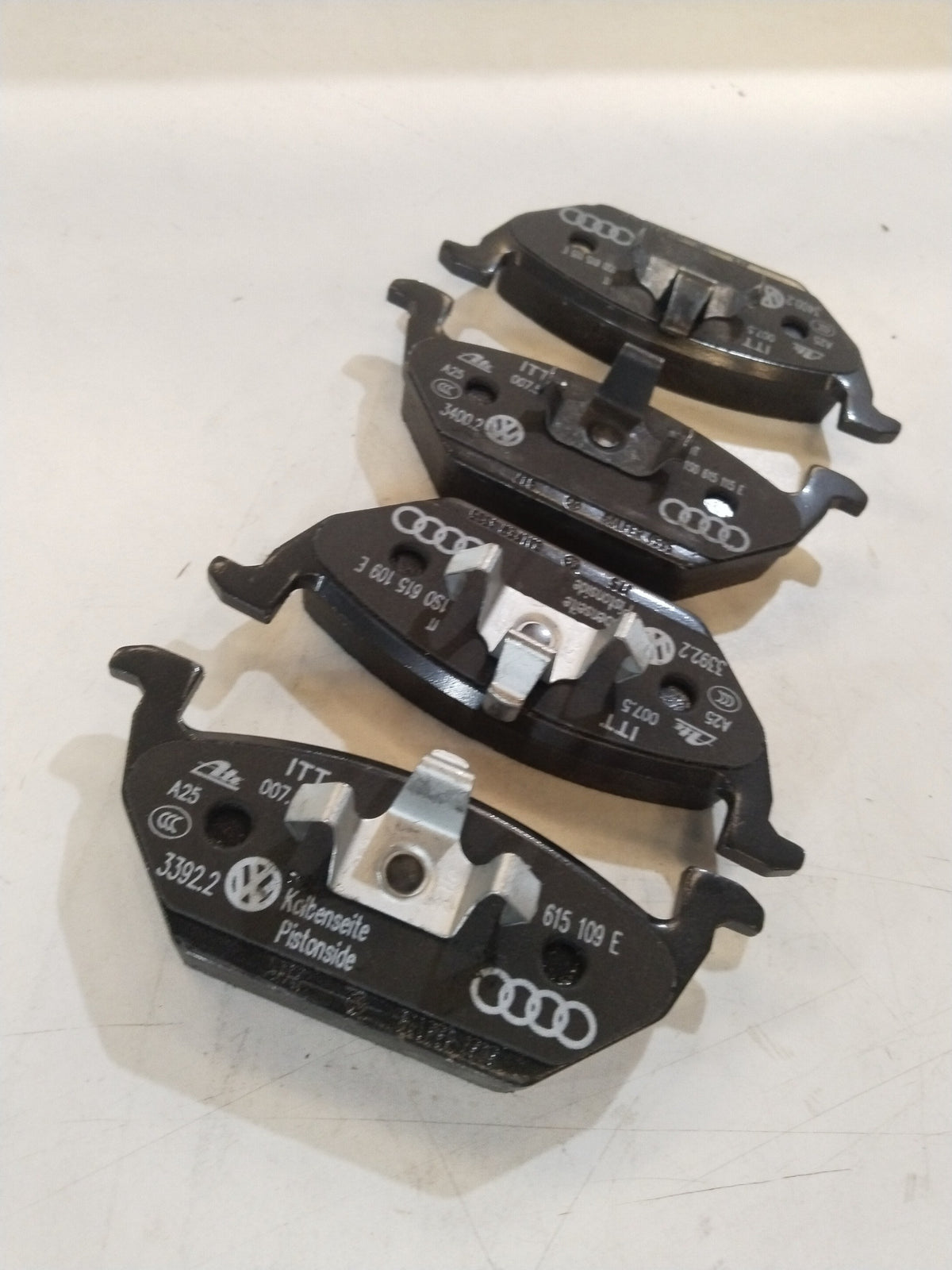 Volkswagen Polo brake lining showing the friction surface and metal backing for reliable vehicle braking performance.