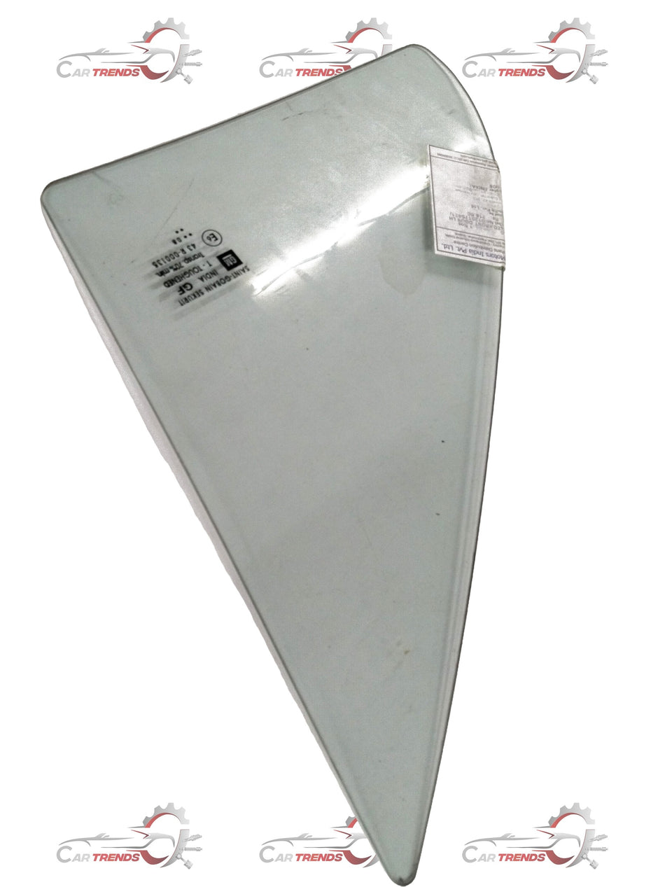 Green fixed front door glass for Chevrolet Spark, left-hand side, by CarTrends, with clear view of the glass and door frame.