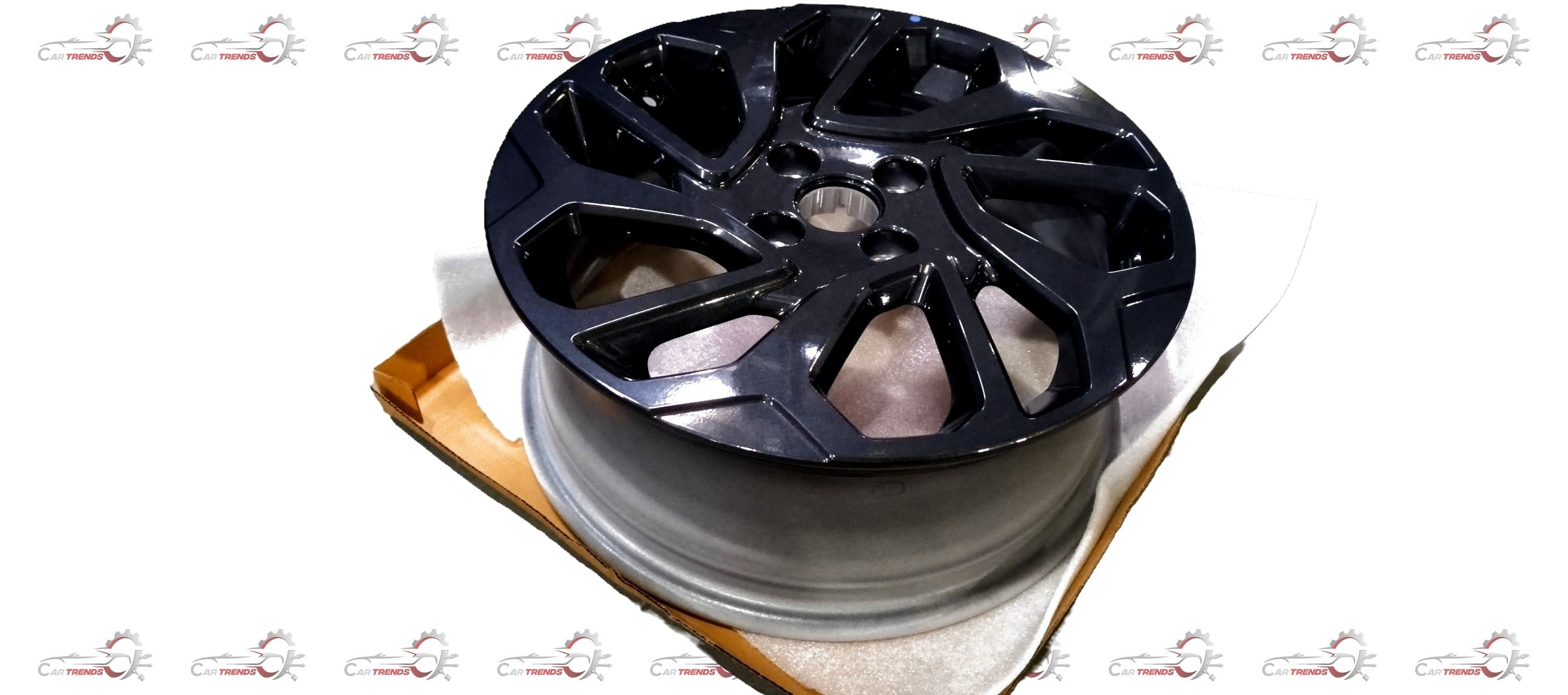 Maruti Suzuki alloy wheel for Fronx vehicle, featuring a stylish multi-spoke design in a close-up view.