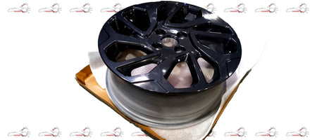 Maruti Suzuki alloy wheel for Fronx vehicle, featuring a stylish multi-spoke design in a close-up view.