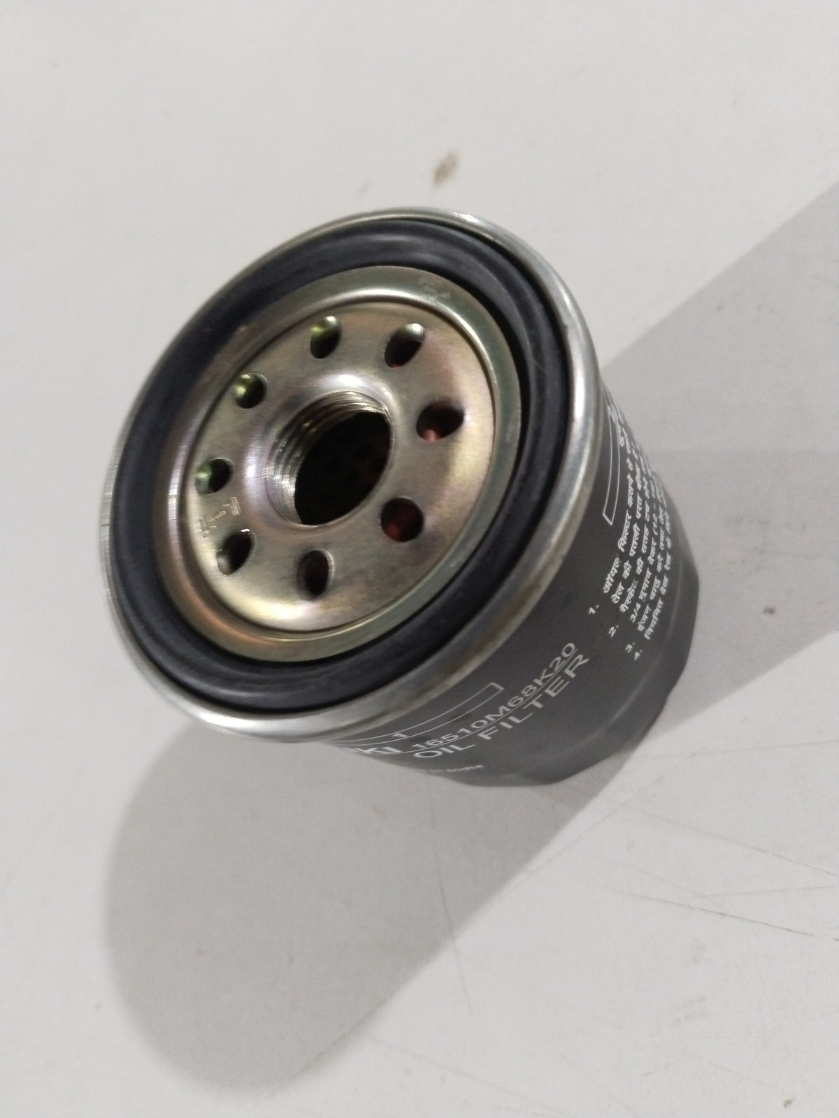 CarTrends oil filter for Suzuki, spare parts, showing the cylindrical metal filter with threading and rubber sealing edge.
