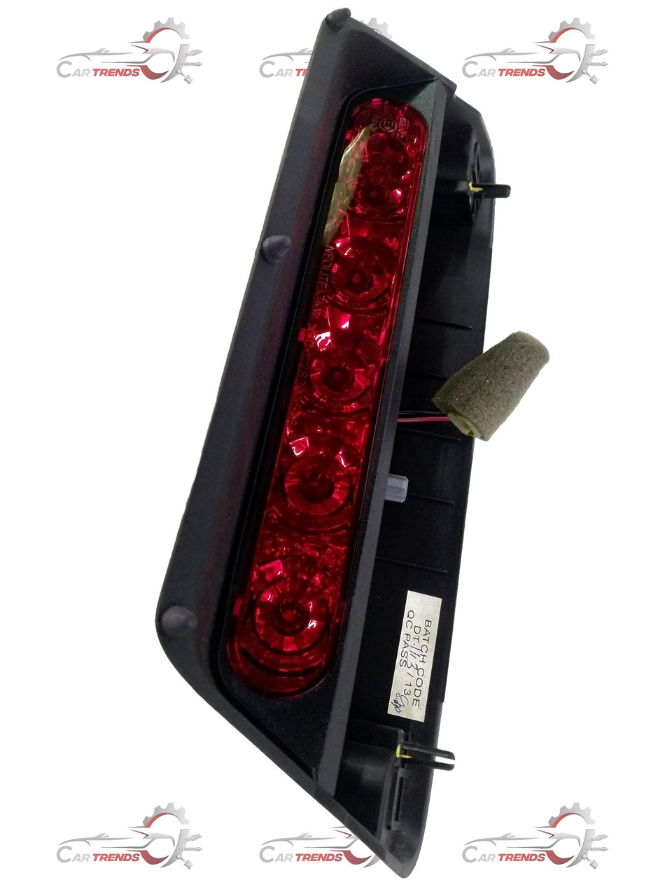 High mount stop lamp assembly for Chevrolet Spark by General Motors, showing the clear lens and mounting bracket.
