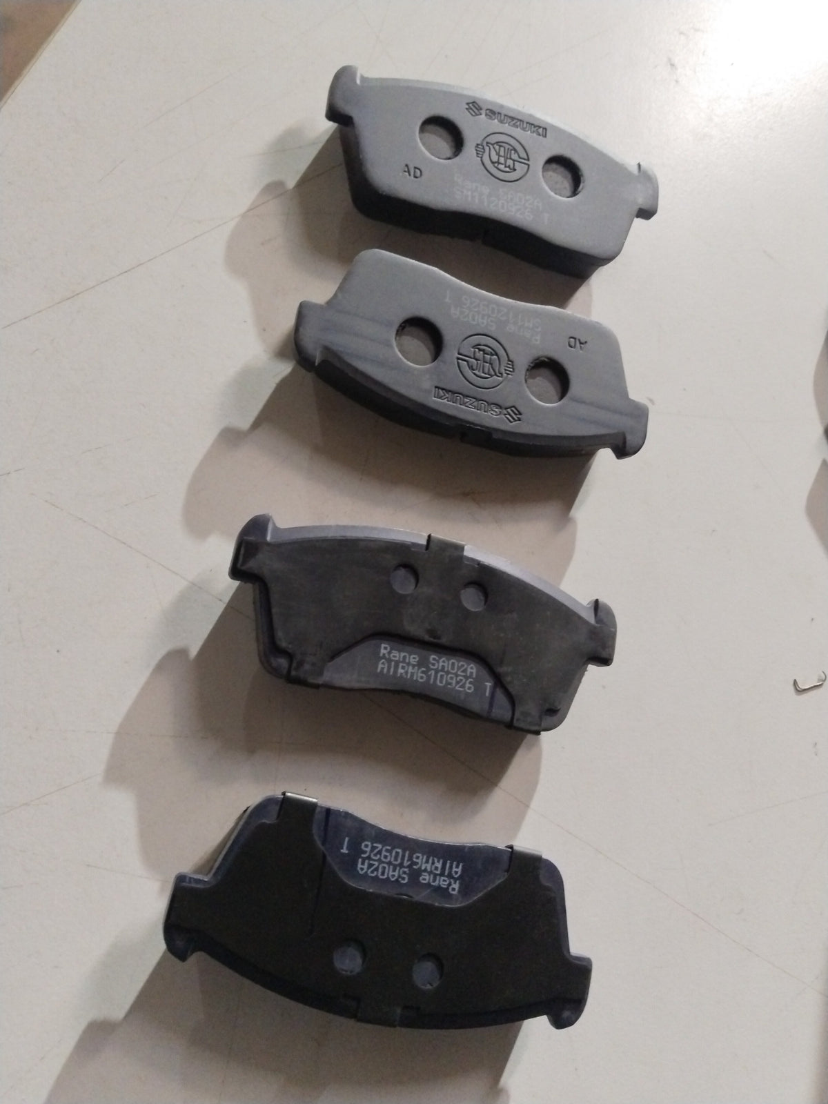 Front brake pad for Maruti Suzuki Eeco and Versa, all variants, showing the new brake pad with metal backing and friction surface.