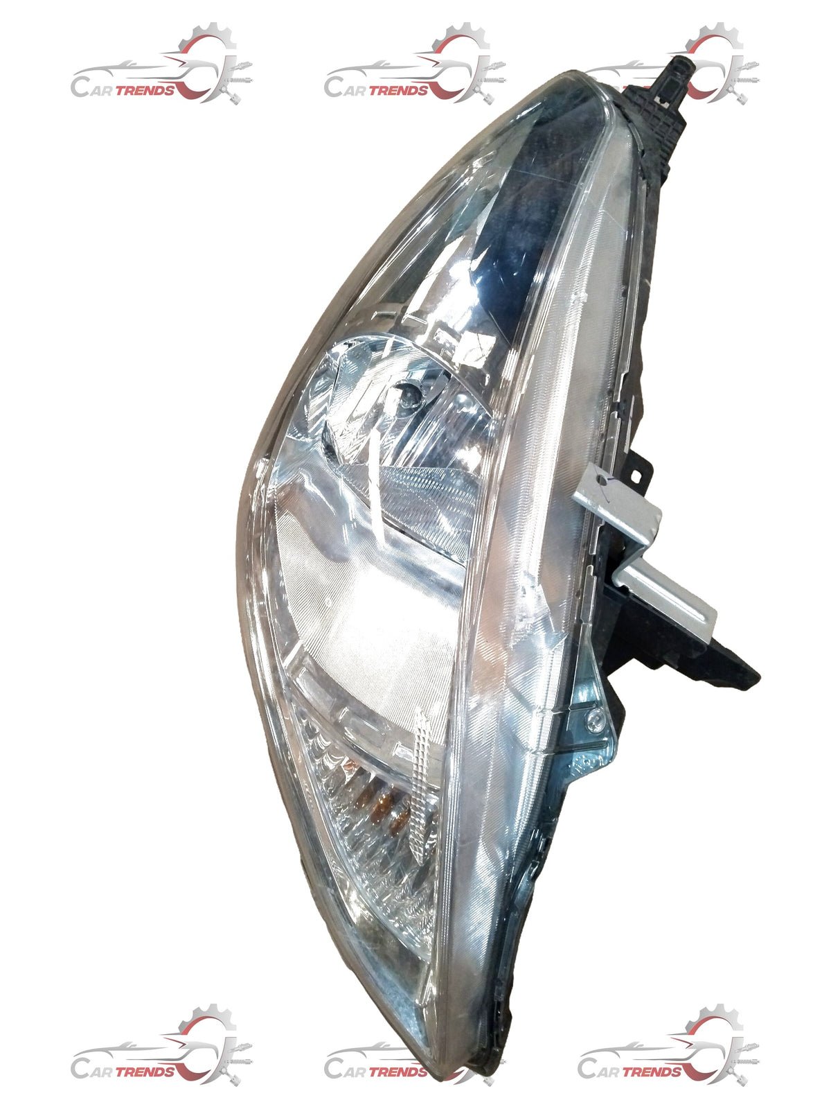 Nissan Sunny head lamp assembly showing the car's front headlight unit with clear lens and black housing.