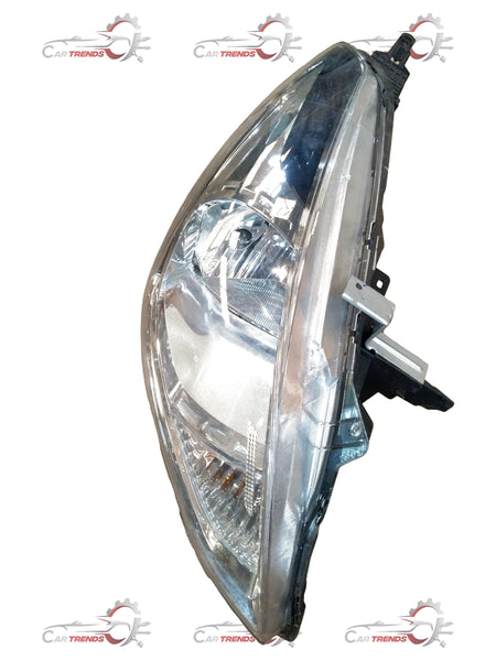 Nissan Sunny head lamp assembly showing the car's front headlight unit with clear lens and black housing.