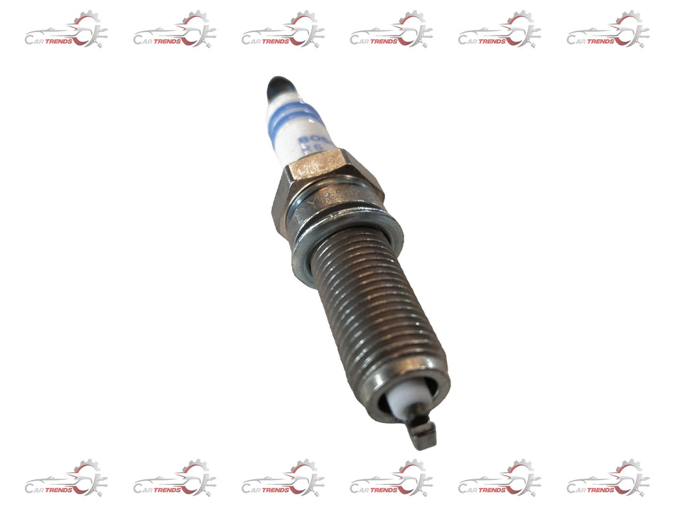 CarTrends spark plug for Tata Nexon petrol engine, showing a close-up view of the new replacement spark plug with metal electrodes.