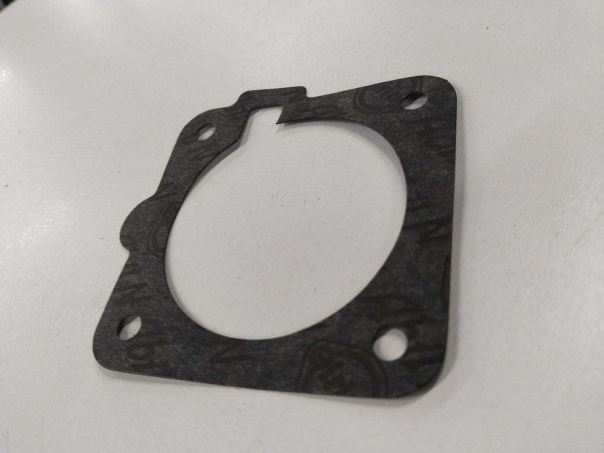 Fuel injector gasket for Chevrolet Corsa, showing a close-up of the gasket body used in fuel meter assemblies by General Motors.