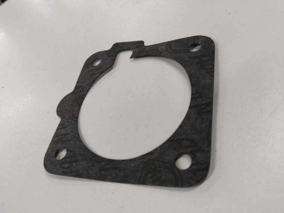 Fuel injector gasket for Chevrolet Corsa, showing a close-up of the gasket body used in fuel meter assemblies by General Motors.