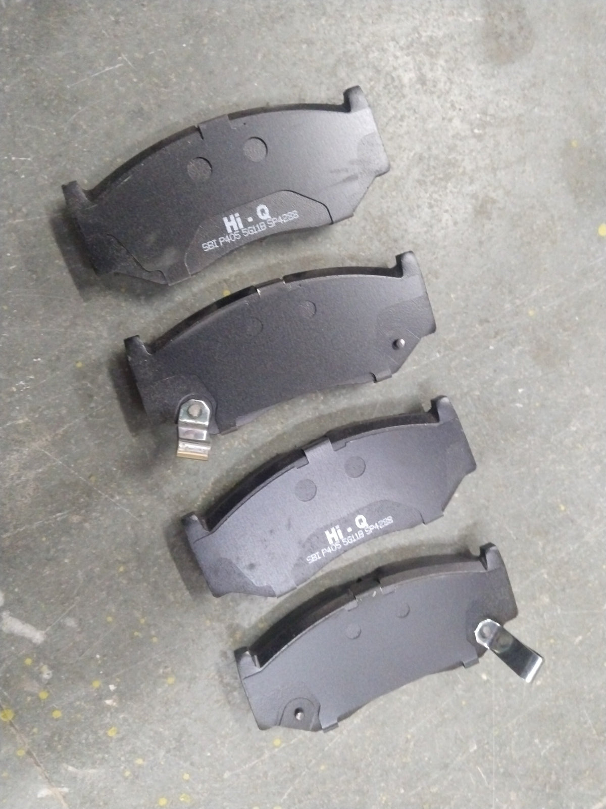 Hi-Q front brake pad for Baleno, New Dzire, New Swift, and Glanza, shown in a close-up image with metallic brake pad and branding.
