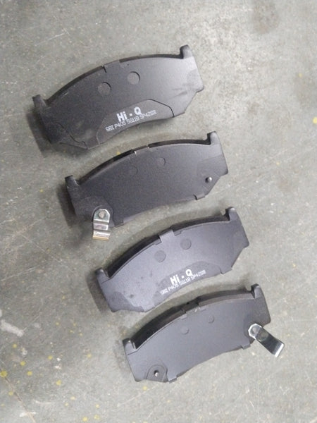 Hi-Q front brake pad for Baleno, New Dzire, New Swift, and Glanza, shown in a close-up image with metallic brake pad and branding.