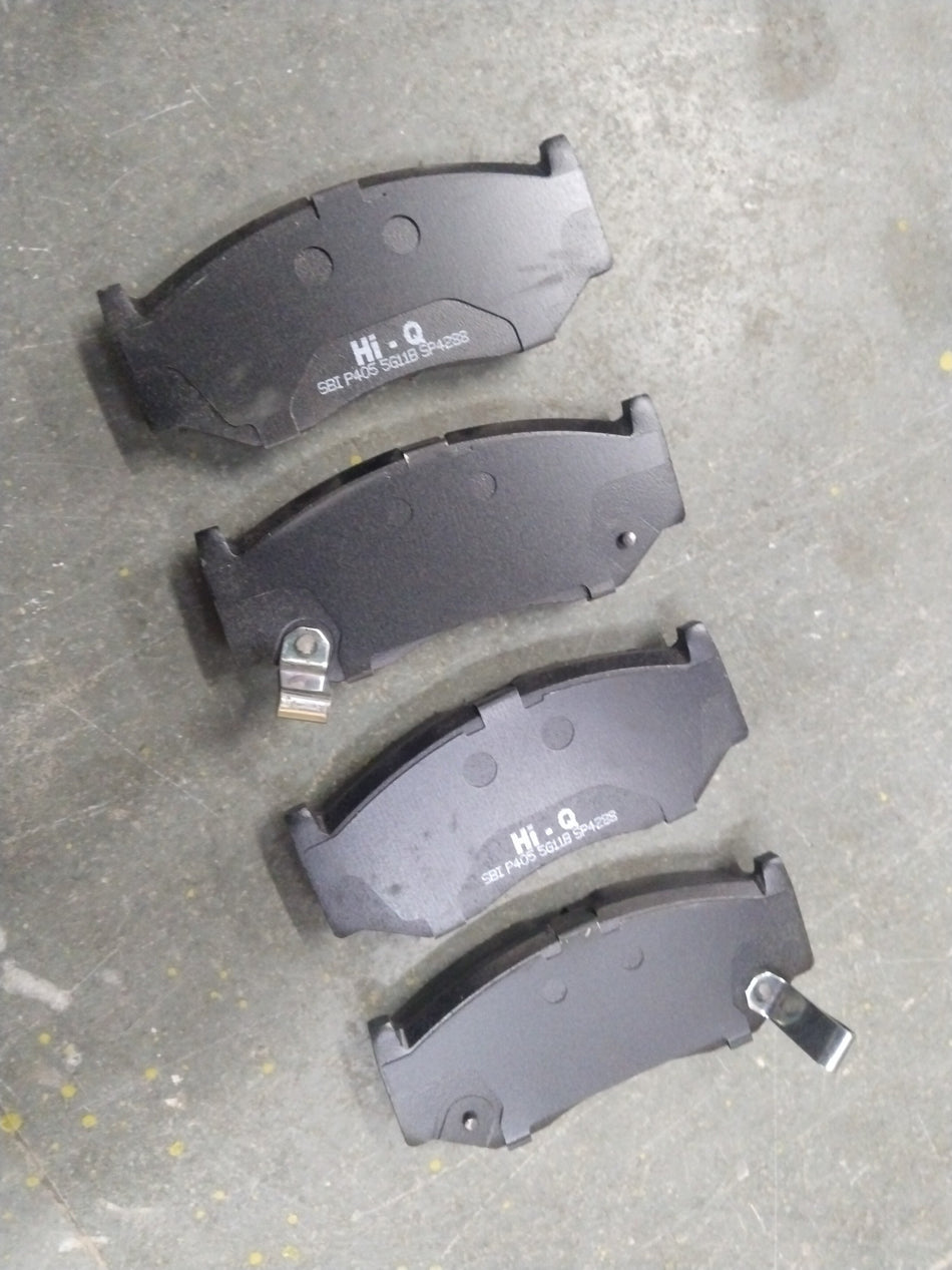 Hi-Q front brake pad for Baleno, New Dzire, New Swift, and Glanza, shown in a close-up image with metallic brake pad and branding.