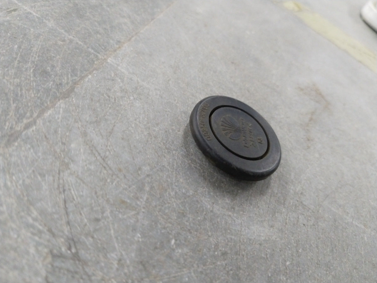 Chevrolet Optra engine plug with general motors branding, showcasing the black plastic and metal connector on a plain background.