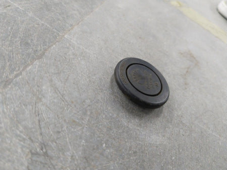Chevrolet Optra engine plug with general motors branding, showcasing the black plastic and metal connector on a plain background.